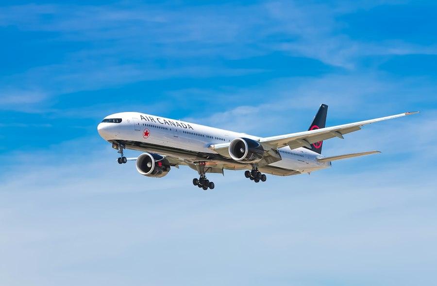 Wide-body aircraft climbing into a blue sky